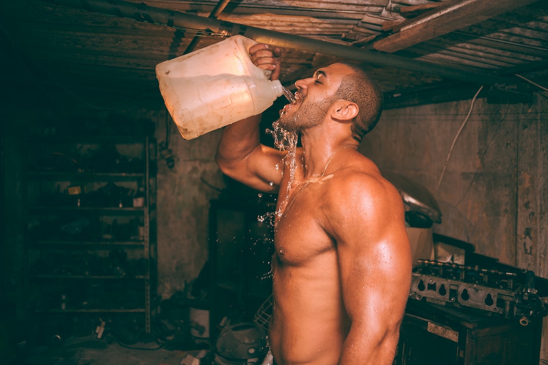 Chugging Water by Perfume Brands topless man drinking water from plastic container