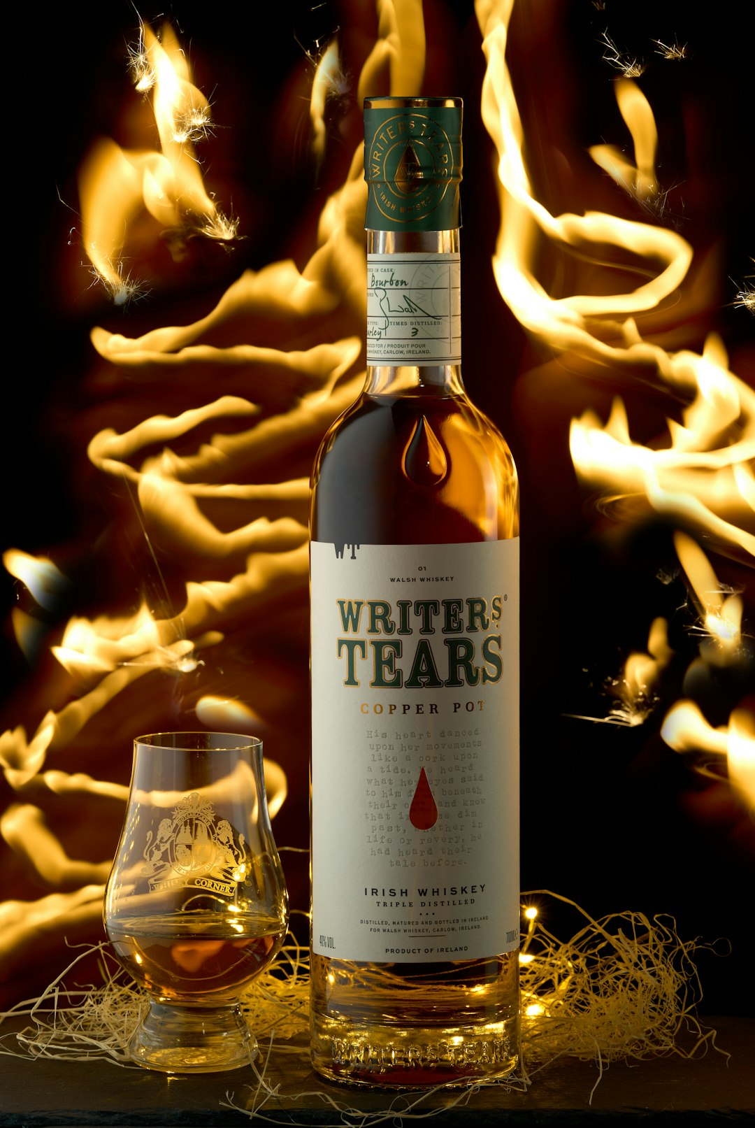 a bottle of wine sitting next to a glass