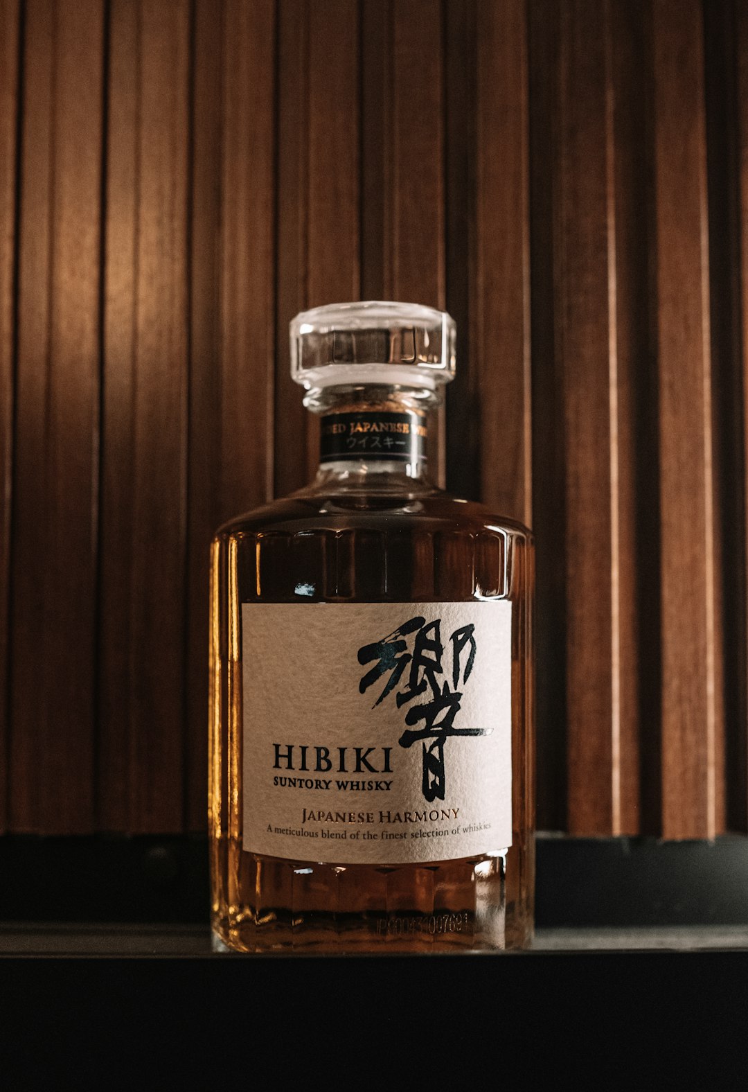A bottle of hibiki whisky sitting on a table