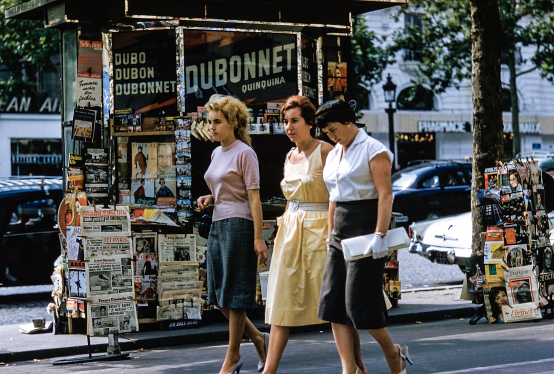 Three retro women by Perfume Brands three women walking on road