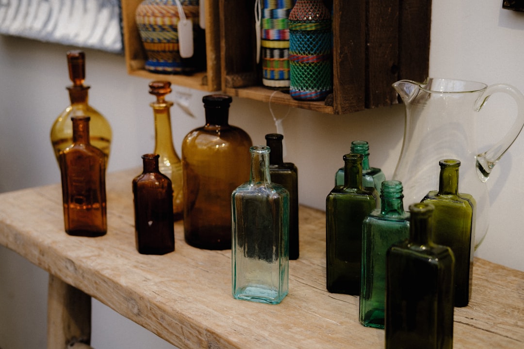 a group of glass bottles on a table